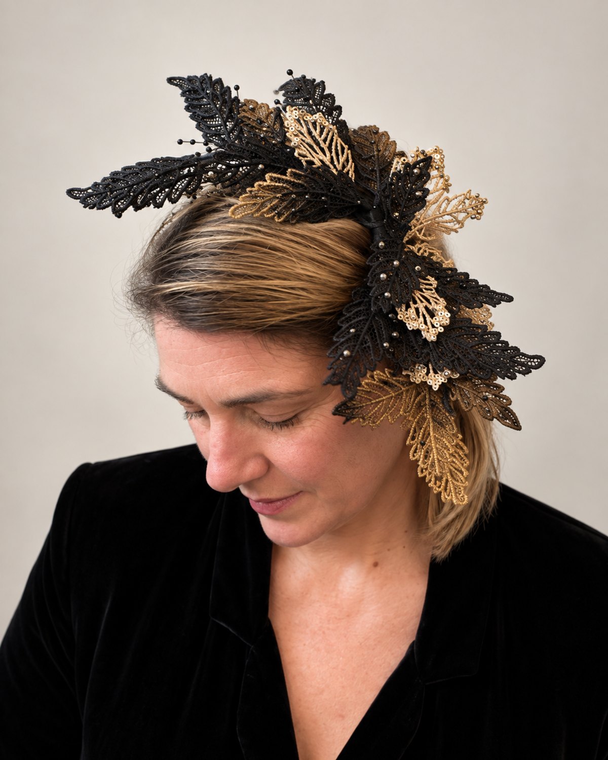 Bespoke black and gold lace leaf headpiece with beading and sequins, handmade by Anna John Designs, New Zealand