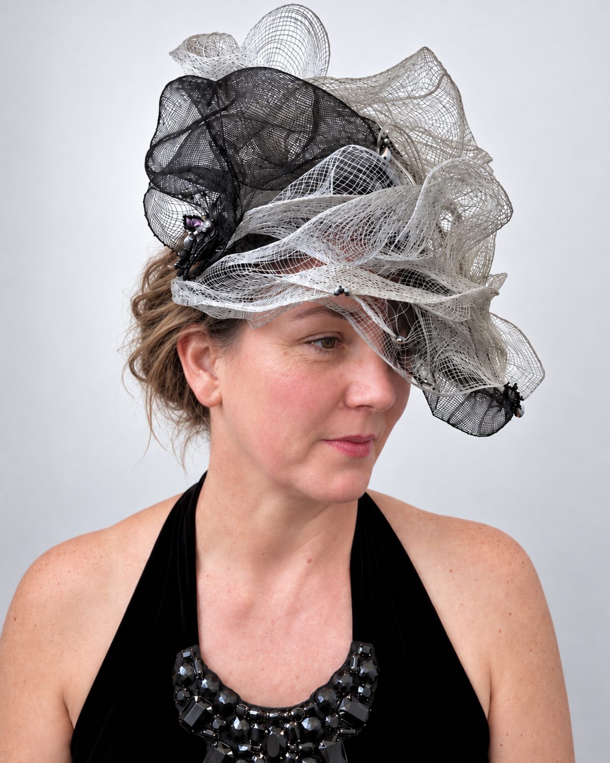 Bespoke silver and black sinamay sculptural hat with hand-beading, handmade by Anna John Designs, New Zealand